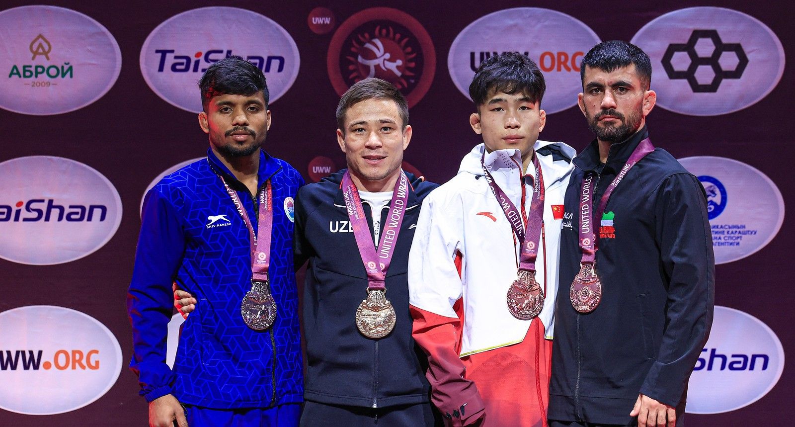 Podium 55kg GR - Gold_ Ikhtiyor Botirov (UZB), Silver_ Lalit Lalit (IND), Bronze_ Huoying Shi (CHN), Mohammad Hajiali Hosseinvand Panahisani (IRI)_9590-X3.jpg